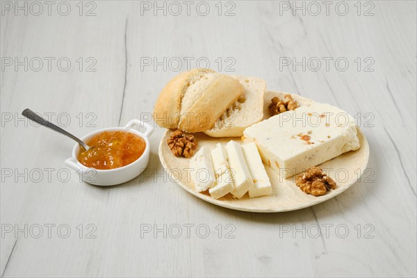 Healthy rustic breakfast. Homemade curd cheese with raisin and walnut