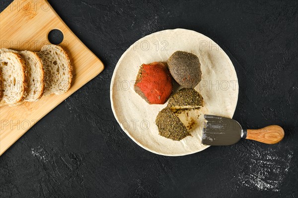 Overhead view of cottage cheese balls mixed with spice and herbs