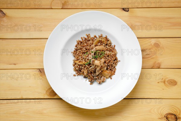 Overhead view of boiled buckwheat with marinated mushrooms