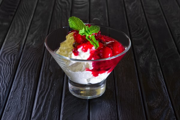 Ice cream with cherry and raspberry jam