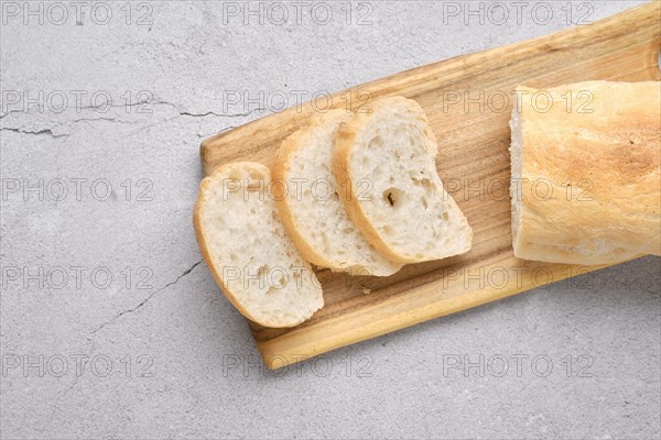 Freshly baked ciabatta on brown wooden table