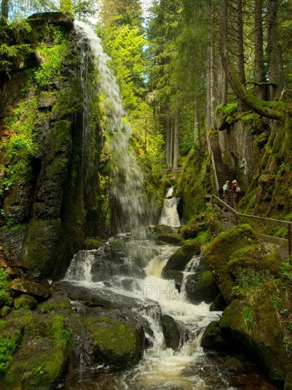 Waterfall and hiking trail in the gorge of the Menzenschwander Alb