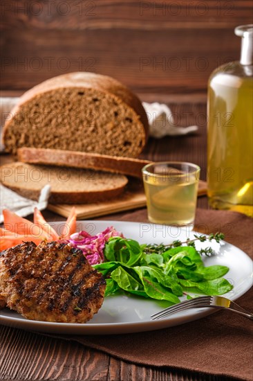 Grilled beef cutlet with fresh salad