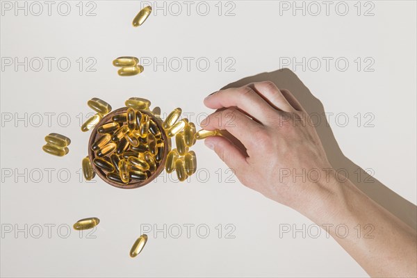 Top view hand picking medical capsules. Resolution and high quality beautiful photo