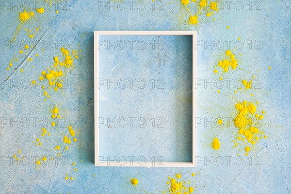 Yellow color powder around the white border frame on painted wall. Resolution and high quality beautiful photo