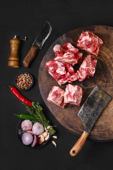 Overhead view of chopped beef bones for making bouillon stock on wooden stump