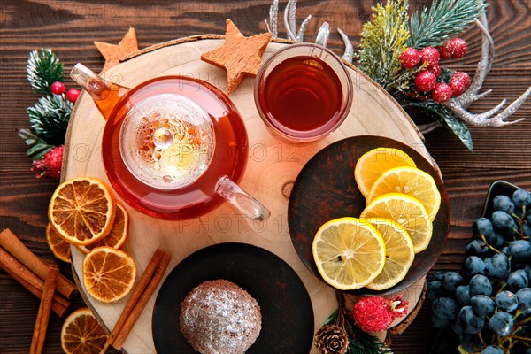 Top view of grape and lemon tea with chocolate cake