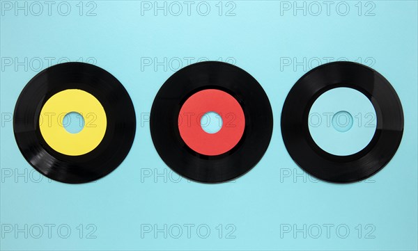 Flat lay old disc records blue background