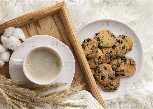 Top view cup coffee with cookies cotton flowers. Resolution and high quality beautiful photo