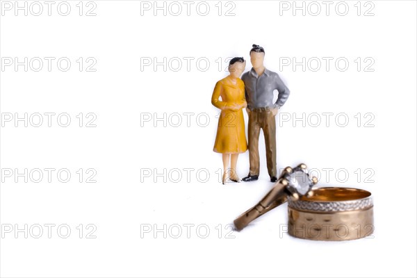 Couple on the phase of engagement with wedding rings on the foreground