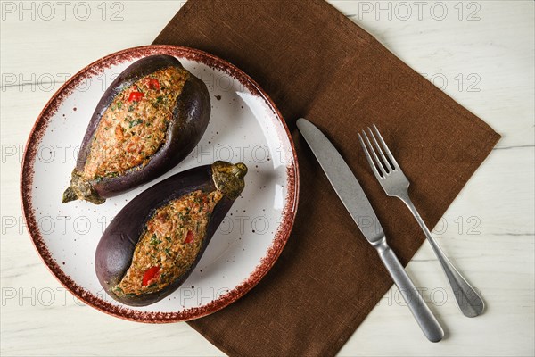 Overhead view of semifinished aubergine with meat and spice filling