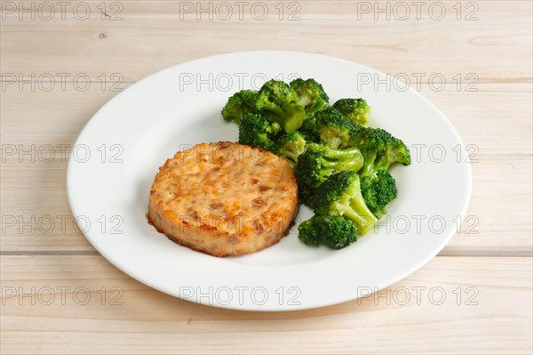 Meat cutlet with cheese and broccoli