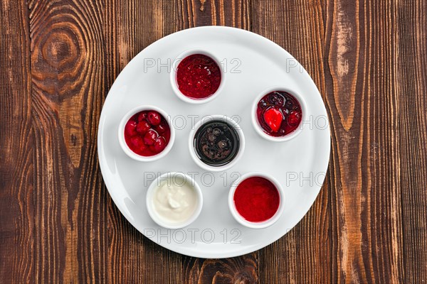 Overhead view of assortment of fruit puree. Jam