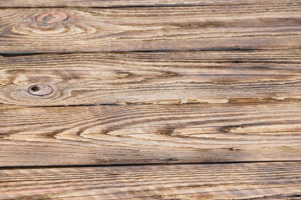 Soft focus photo of old partly burned wooden background