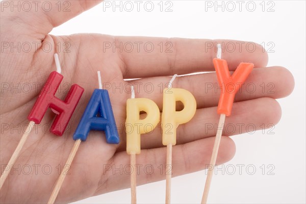 Color candles on sticks write the word happy