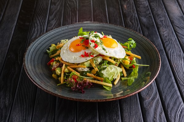 Fried eggs with avocado