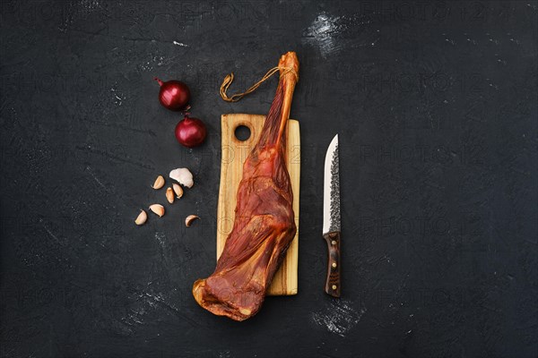 Air dried lamb meat on wooden cutting board