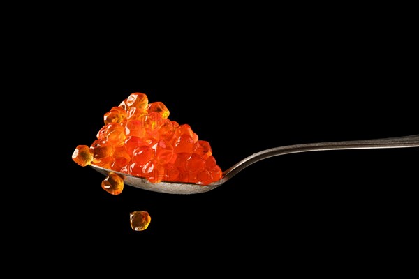 Spoon with salmon red caviar