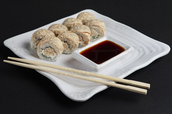 Chicken teriyaki roll with soy sauce and hashi