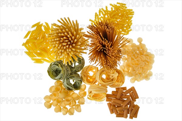 Overhead view of various kinds of pasta isolated on white background