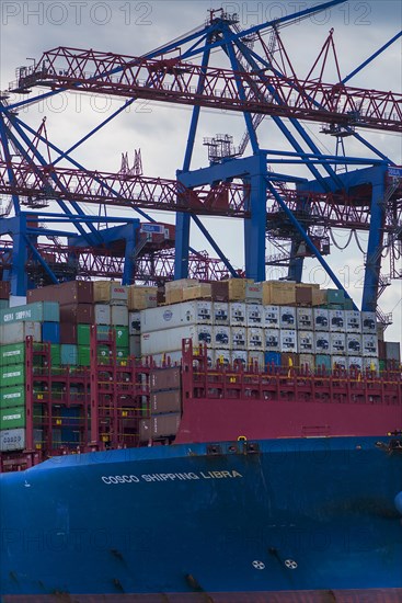 Container ship and unloading cranes in the Port of Hamburg