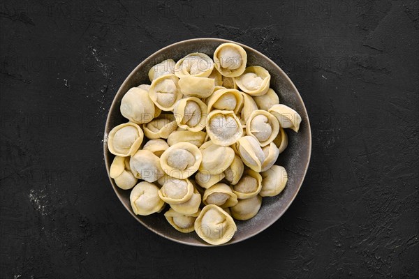 Top view of homemede meat dumplings on on black background