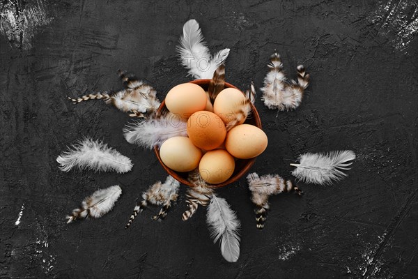 Fresh country eggs in clay bowl