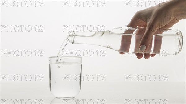 Person pouring water glass. Resolution and high quality beautiful photo
