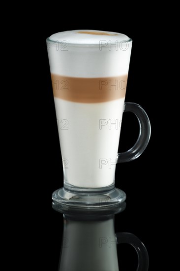 Glass of cappuccino with reflection isolated on black