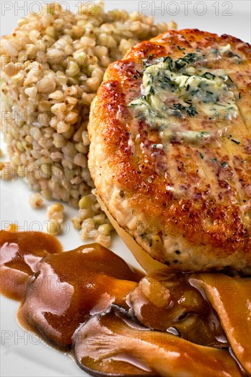 Close up view of meat cutlet with honey mushroom and green buckwheat