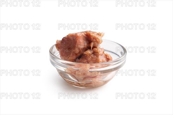 Canned tuna in transparent plate isolated on white