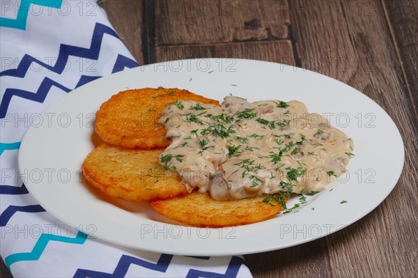 Potato pancakes with mushroom sauce