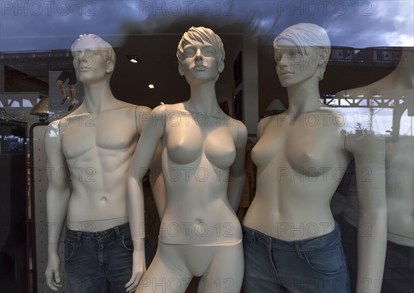 Half-naked mannequins in a fashion shop