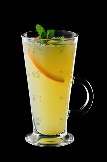 Hot citrus tea isolated on black background