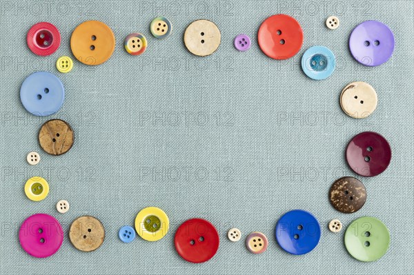 Flat lay colorful buttons on cloth
