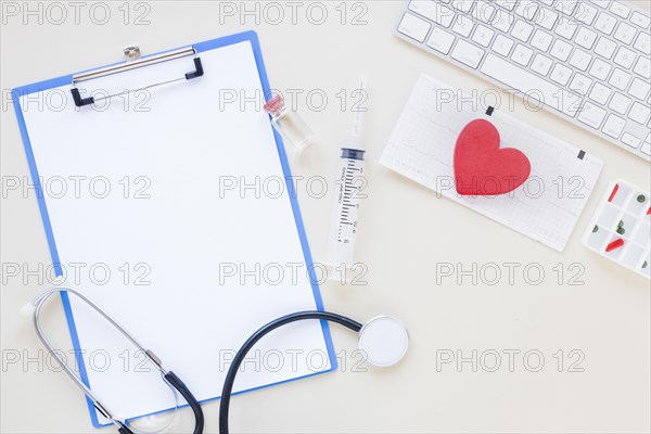 Flat lay medical composition with clipboard template