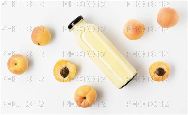 Flat lay peach juice bottle