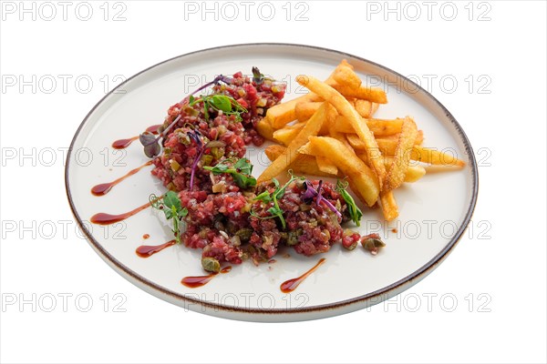 Beef tartare with fried potato isolated on white background