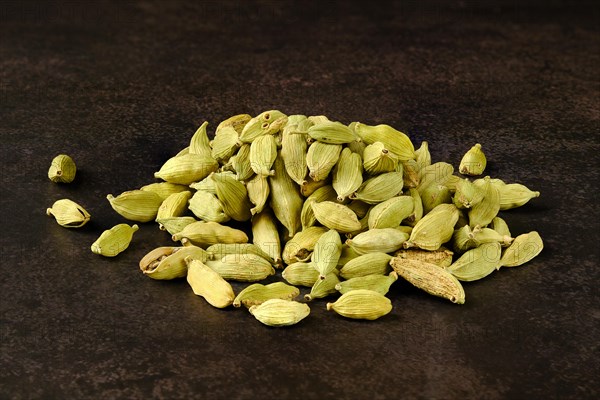 Pile of cardamom on abstract background