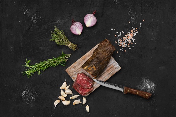 Beef jerky on wooden cutting board