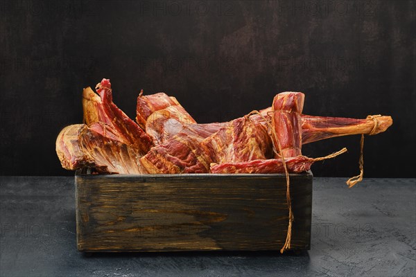 Assortment of air dried and smoked lamb and beef meat in wooden box