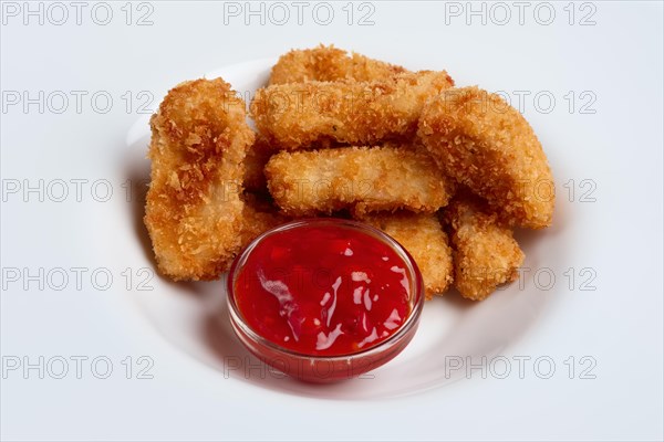 Deep fried chicken nuggets on a plate