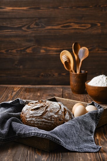 Fresh rye brown bread on wooden cutting board