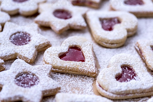 Freshly baked Spitzbuben in the shape of a heart