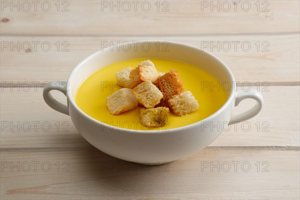 Chicken soup puree with white bread chips