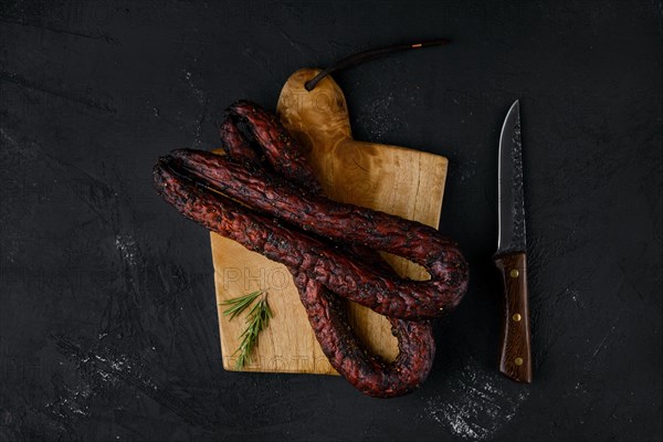 Top view of smoked beef sausage on cutting board