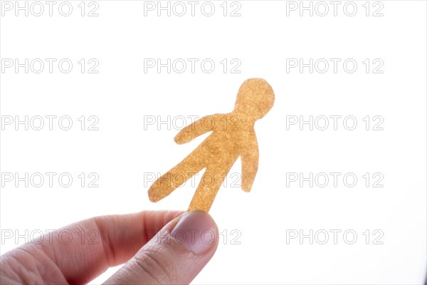 Man shape cut out of paper in hand in the view