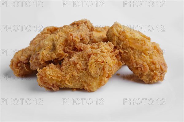 Crisp grilled chicken wings on a white dish