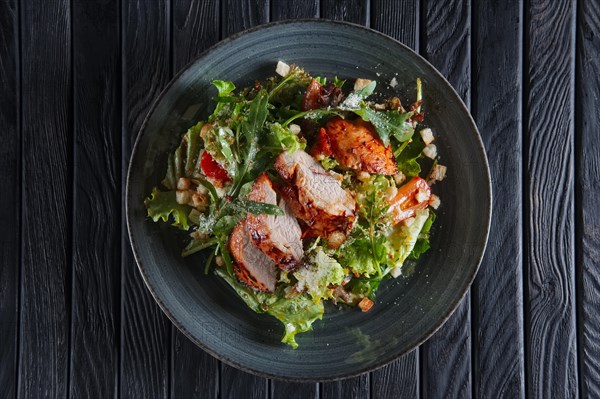 Fried chicken fillet with vegetables and salad dripped with vinegar sauce