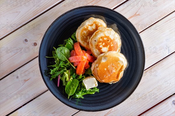 Flapjacks with salmon and fresh salad